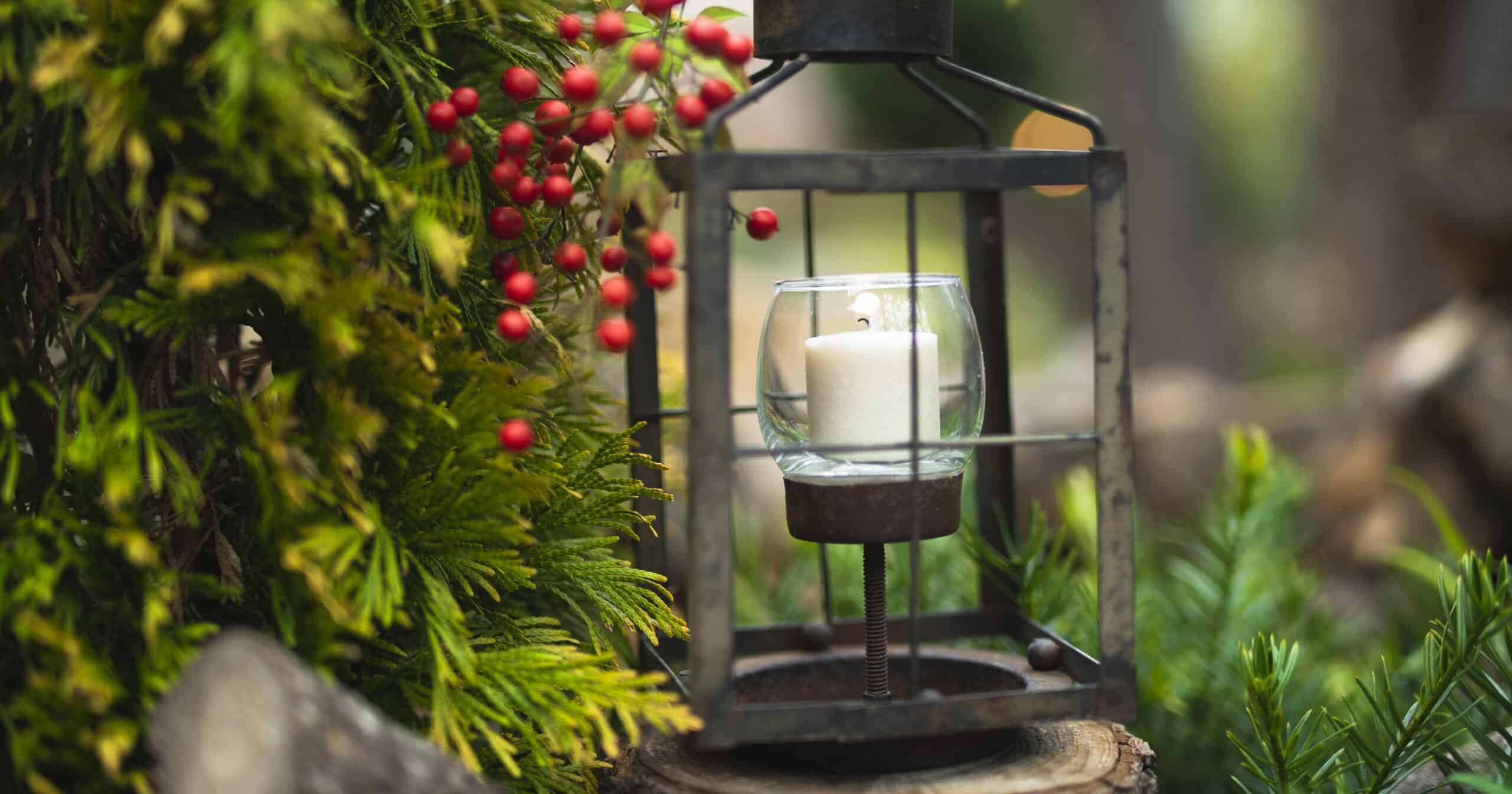 Rustic candle holder with fall foliage, branches, and berries