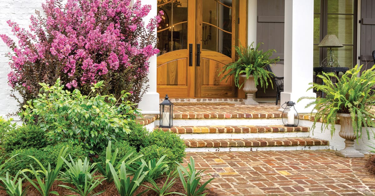 Delta Fusion Crapemyrtles frame an entryway to brick home