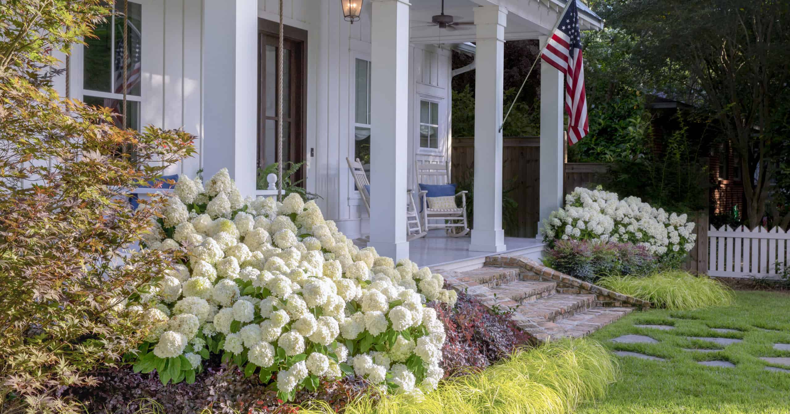 Southern home landscape including White Wedding Hydrangeas and Everillo Carex from Southern Living
