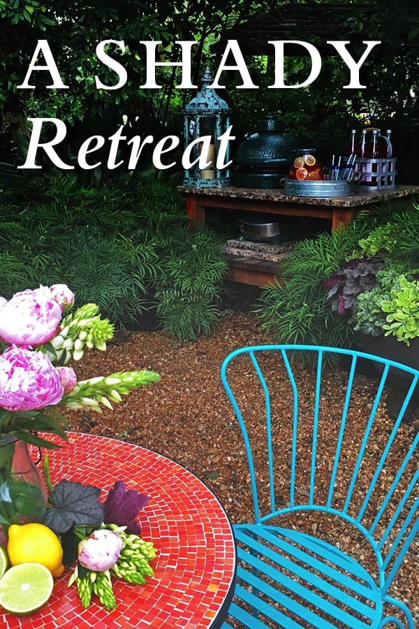Mosaic red table with blue chair and a vase of flowers