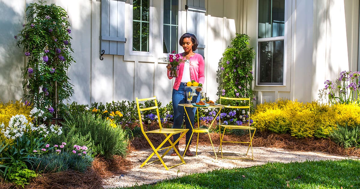lady with yellow patio furniture